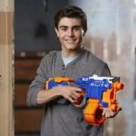 boy playing with Nerf and Strike Elite Hyperfire Blaster