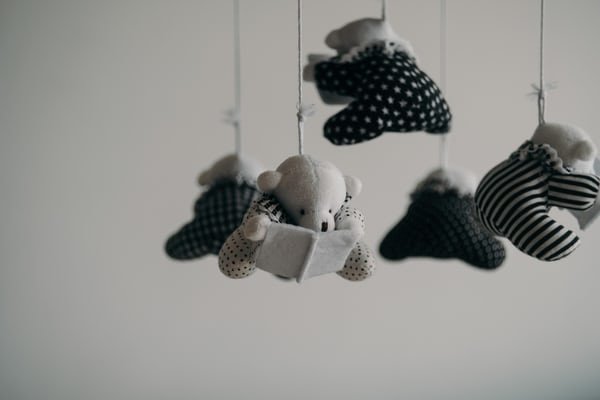 baby crib toys hanging in a crib