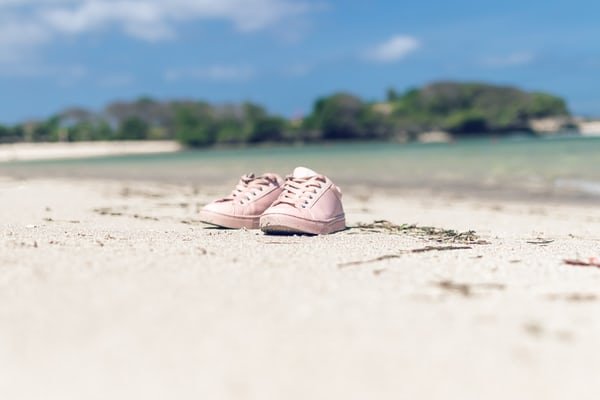 pink shoes beach